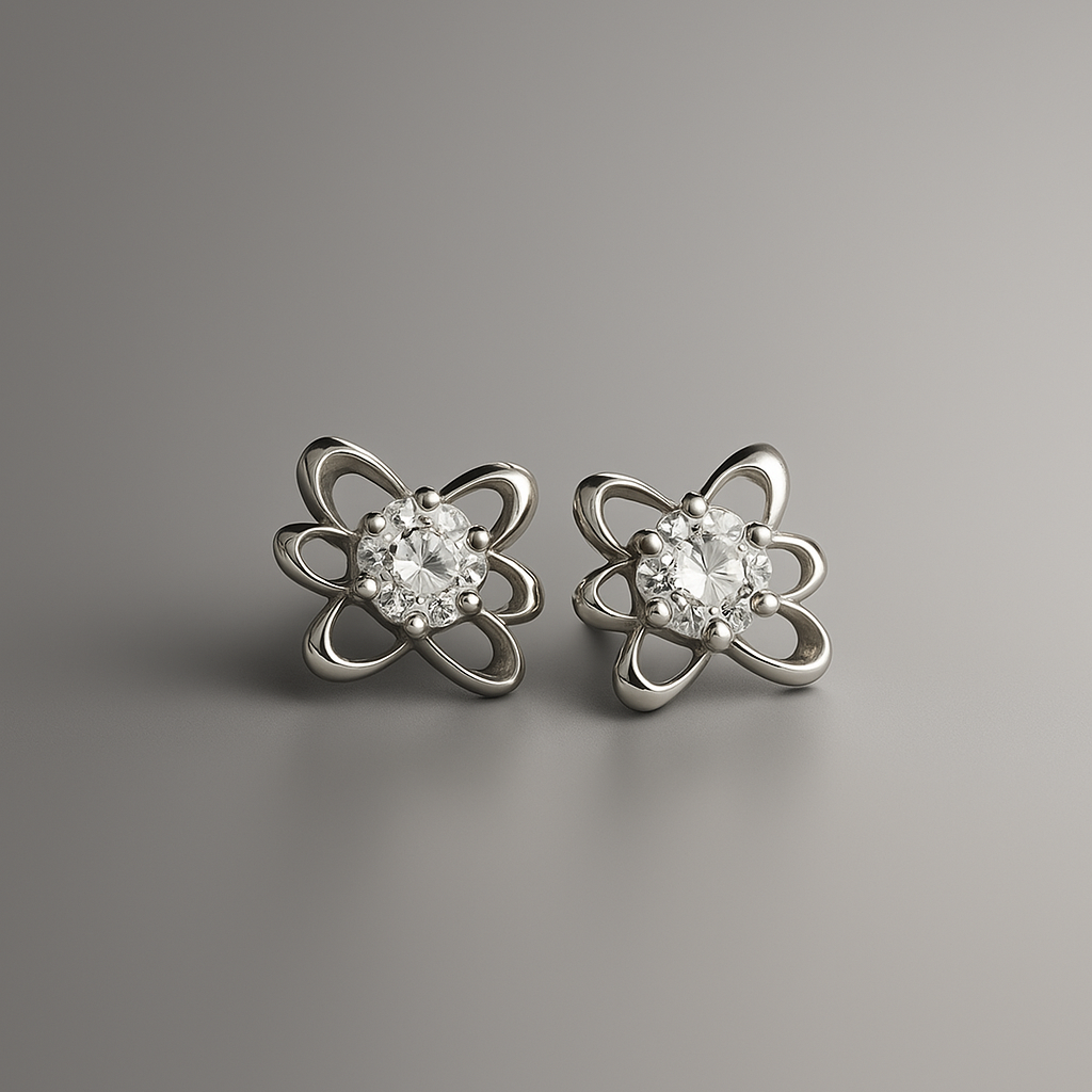 Pair of silver flower-shaped earrings with clear gemstones on a gray background