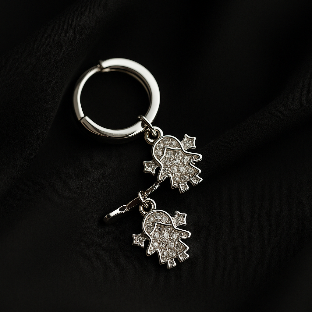 Silver keychain with Hamsa hand charms on a black background