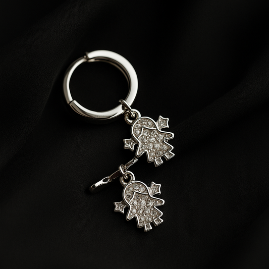 Silver keychain with Hamsa hand charms on a black background
